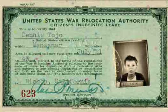 Image of an official United States War Relocation ID with a picture of an 8-year old Dennis Tojo